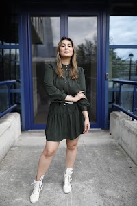 Young Woman Portrait in Front of Modern Building Staircase