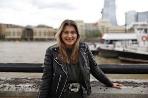 Young Woman Portrait in Front of Modern Building Staircase