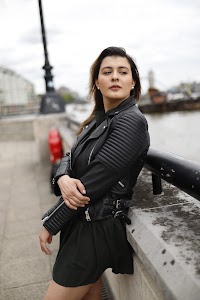 Young Woman Portrait in Front of Modern Building Staircase
