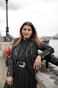 Young Woman Portrait in Front of Modern Building Staircase