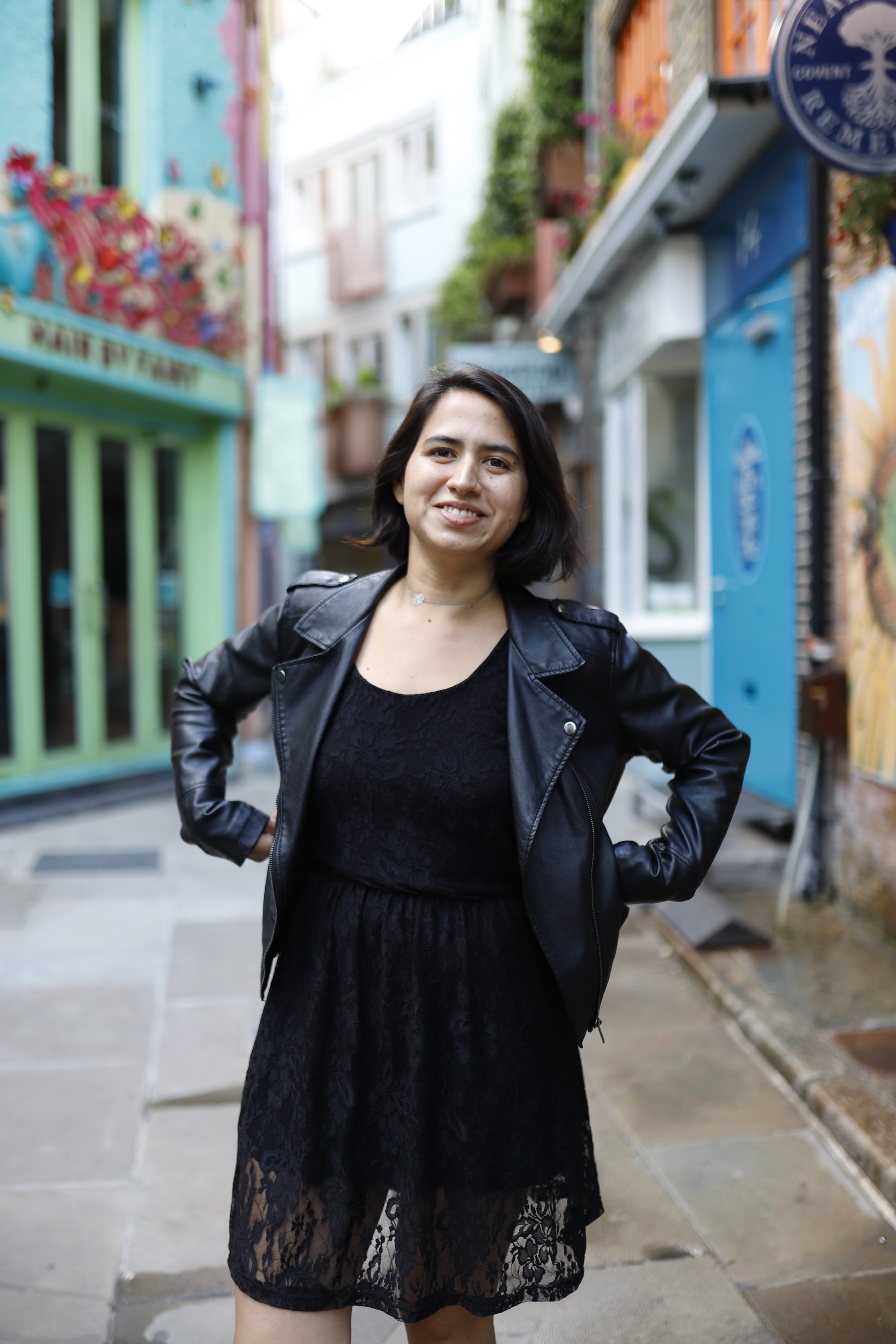 Woman Walking Through Narrow London Alley