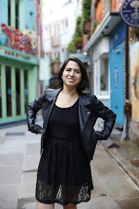 Woman Walking Through Narrow London Alley