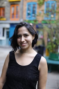 Woman Walking Through Narrow London Alley
