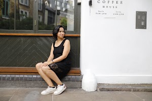 Woman Walking Through Narrow London Alley