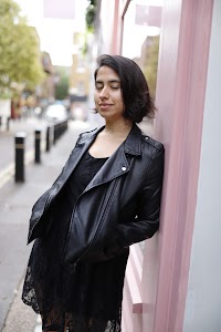 Woman Walking Through Narrow London Alley