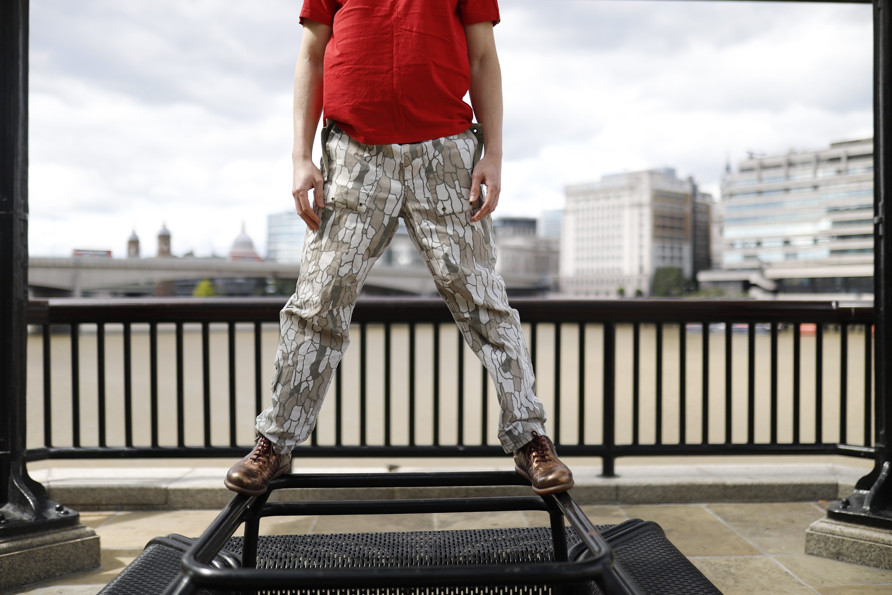 Young Man in Red T-Shirt on Urban Street