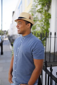 Man in Panama Hat Walking on a London Street