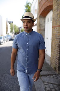 Man in Panama Hat Walking on a London Street