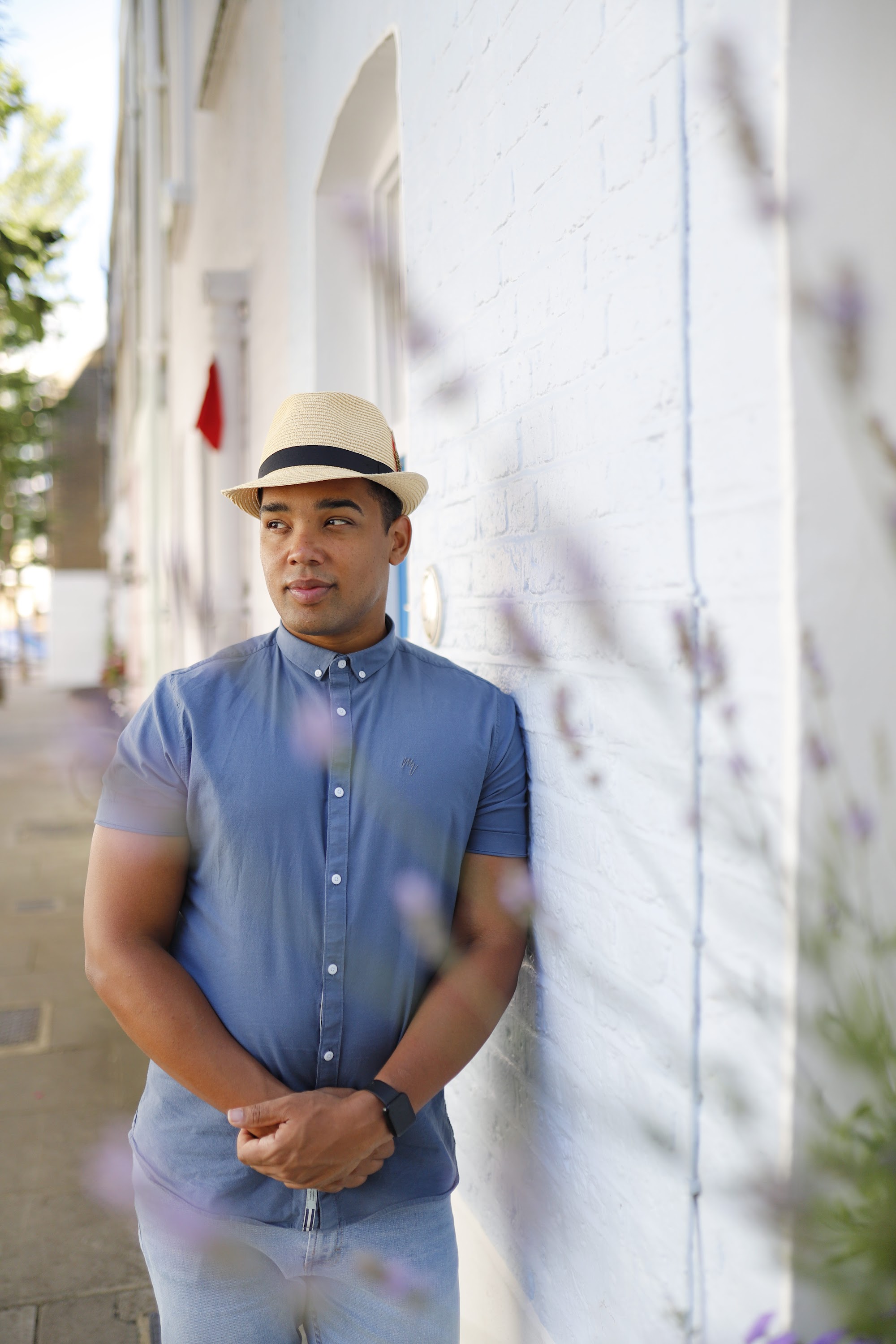 Man in Panama Hat Walking on a London Street