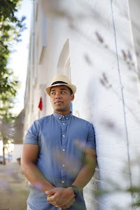Man in Panama Hat Walking on a London Street