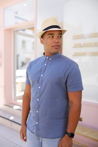 Man in Panama Hat Walking on a London Street