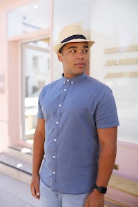 Man in Panama Hat Walking on a London Street