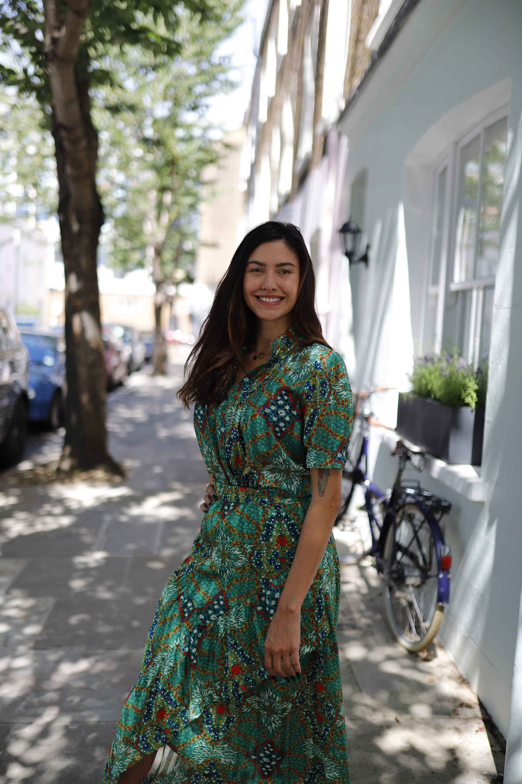 Woman in Green Botanical-Print Maxi Dress Outside London Mews
