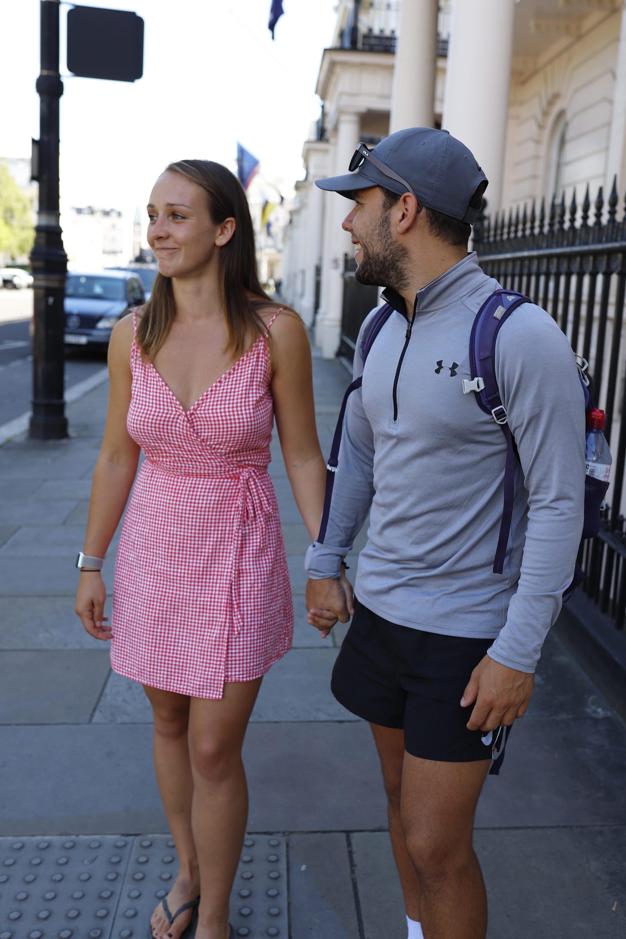 Blurred Couple in Front of Pink Café, Urban Street Scene