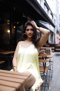 Woman in Yellow Fringe Dress on European City Street