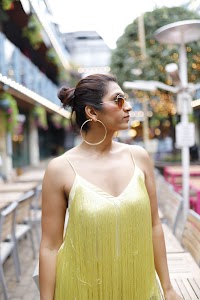 Woman in Yellow Fringe Dress on European City Street
