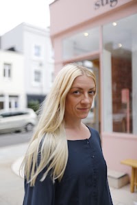 Woman on London Street with Hand Over Face