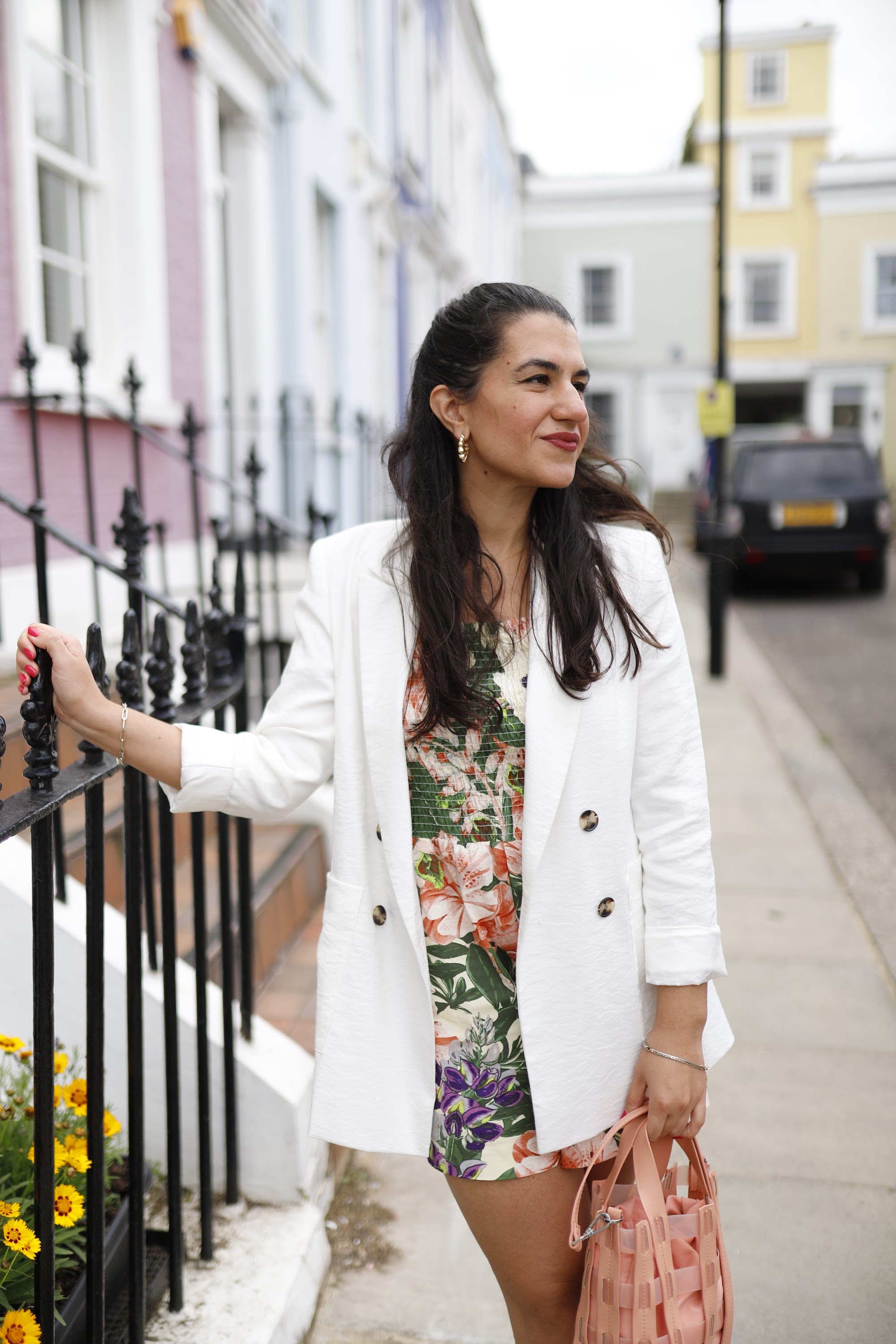 Woman in Floral Outfit on London Street