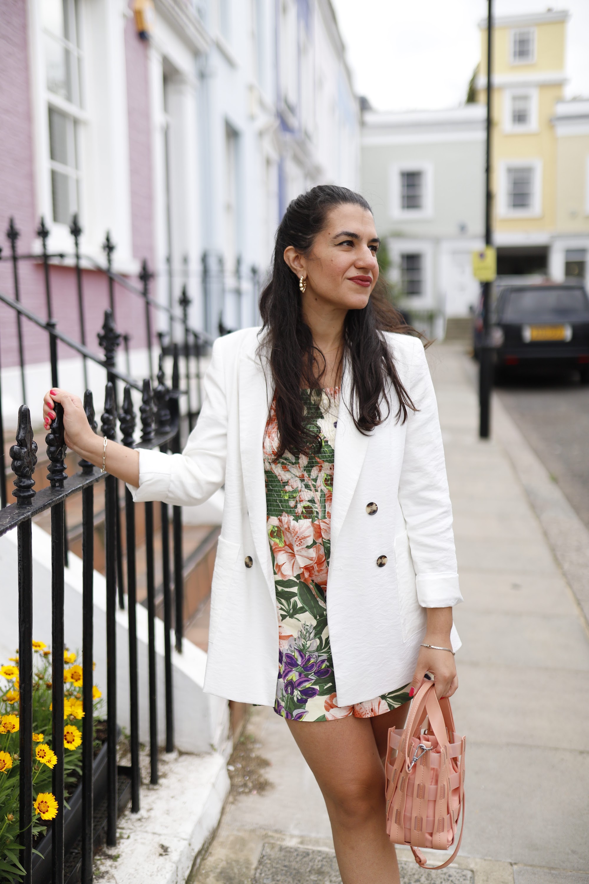 Woman in Floral Outfit on London Street