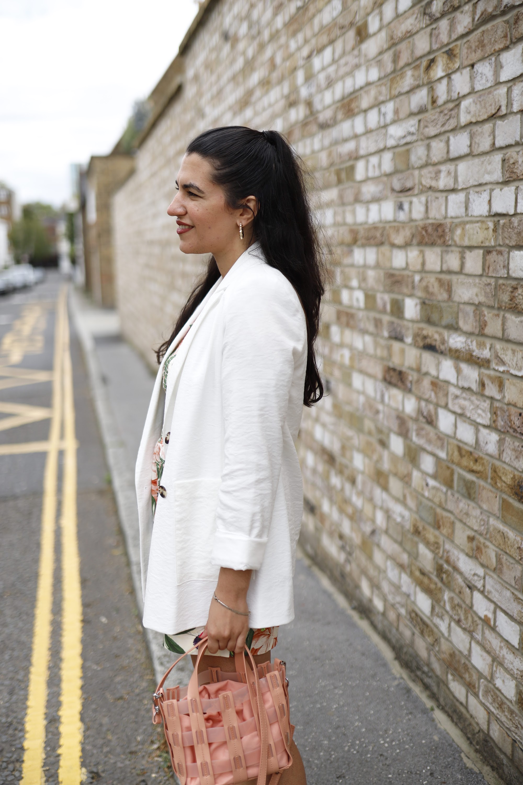 Woman in Floral Outfit on London Street