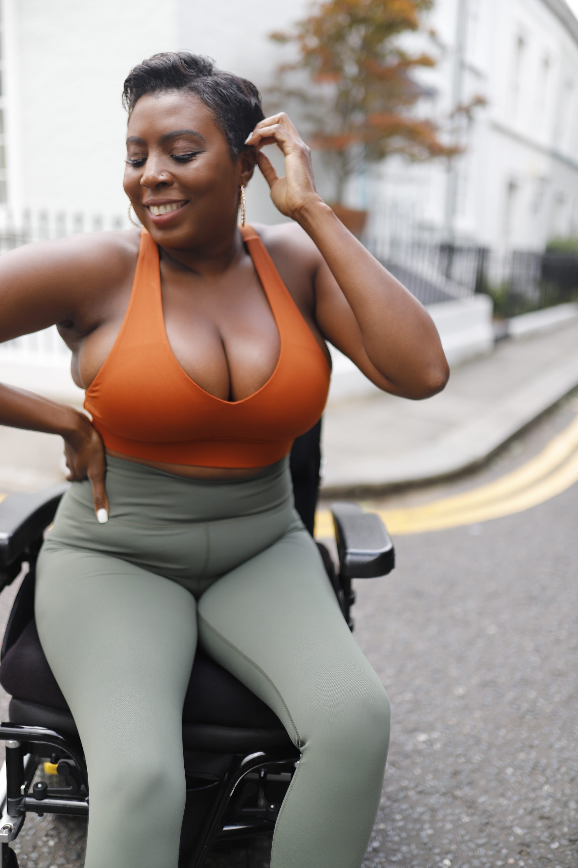 Woman in Power Wheelchair on London Residential Pavement