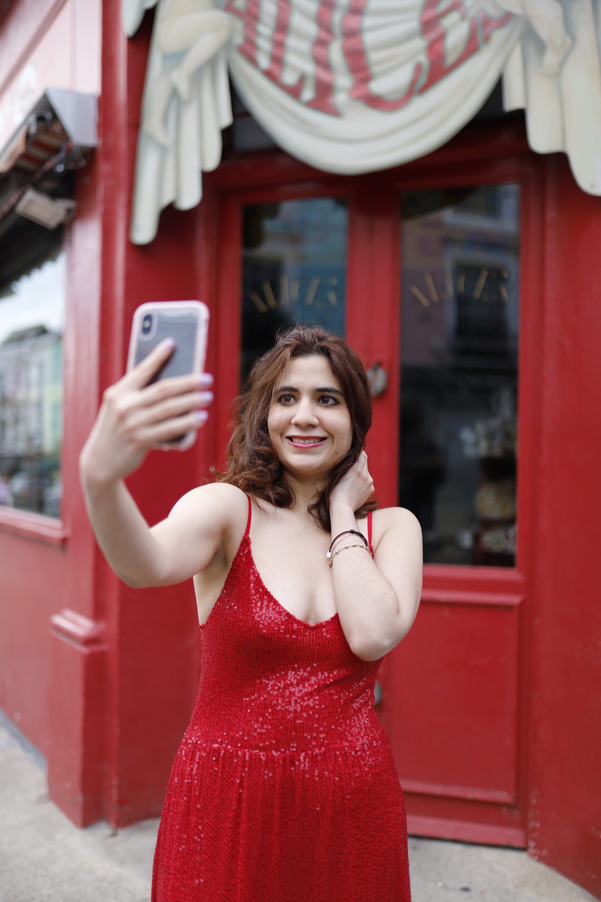 Woman in Red Sequin Dress at Notting Hill, London