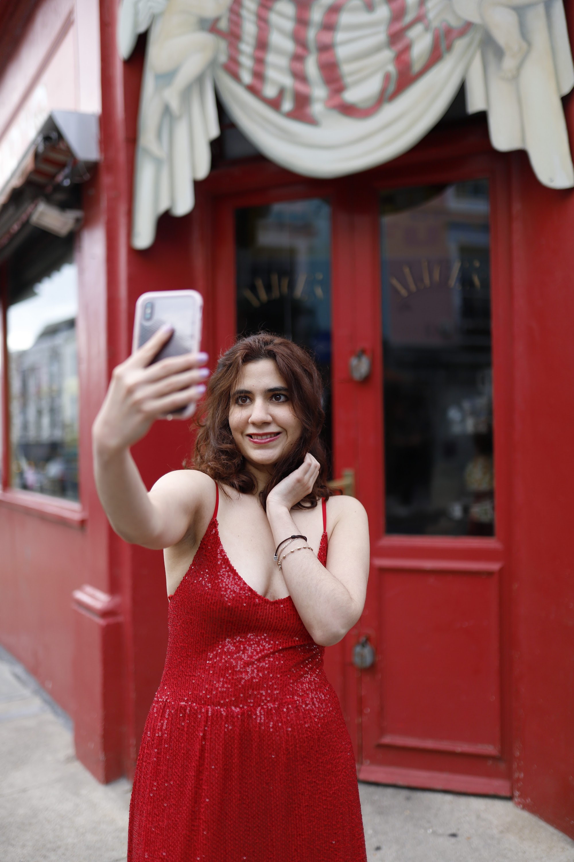 Woman in Red Sequin Dress at Notting Hill, London