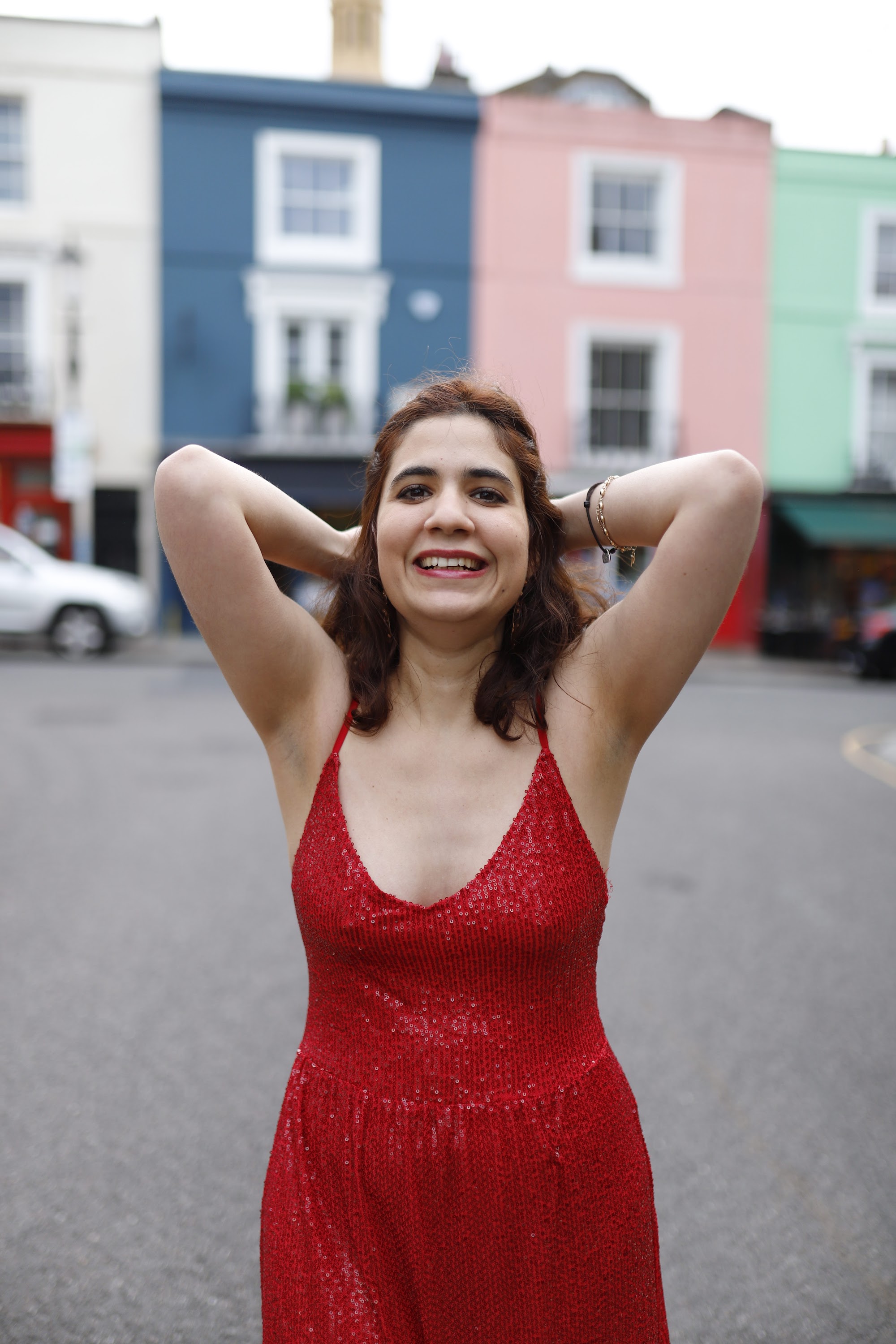 Woman in Red Sequin Dress at Notting Hill, London