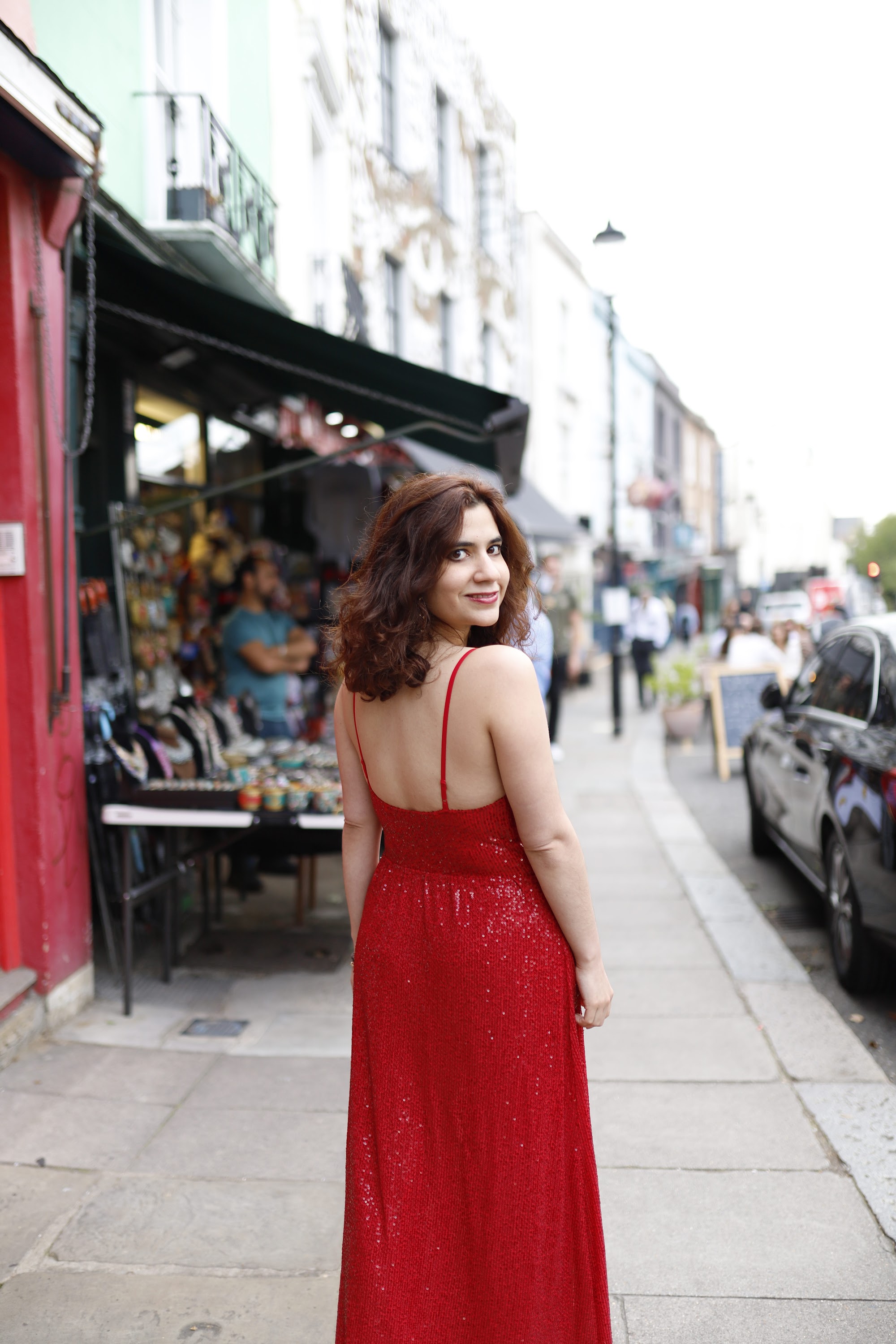 Woman in Red Sequin Dress at Notting Hill, London