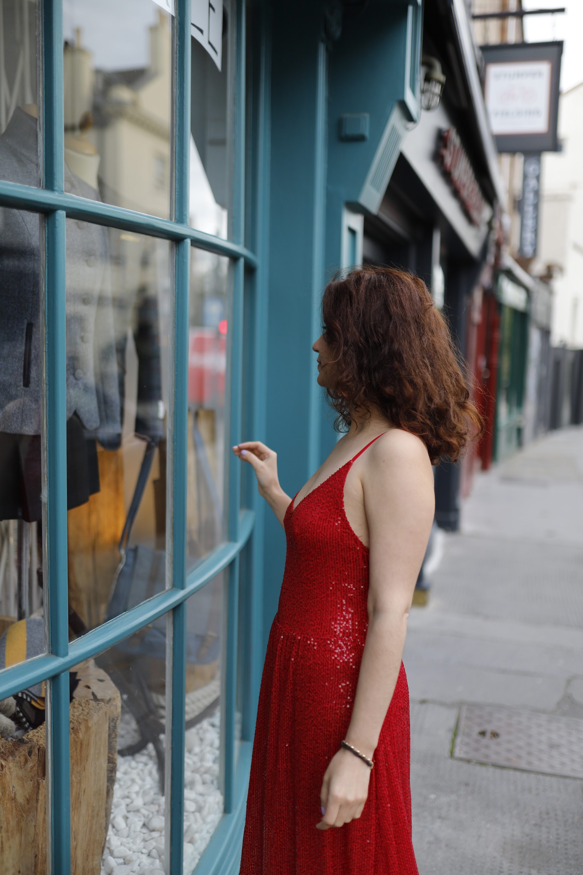 Woman in Red Sequin Dress at Notting Hill, London