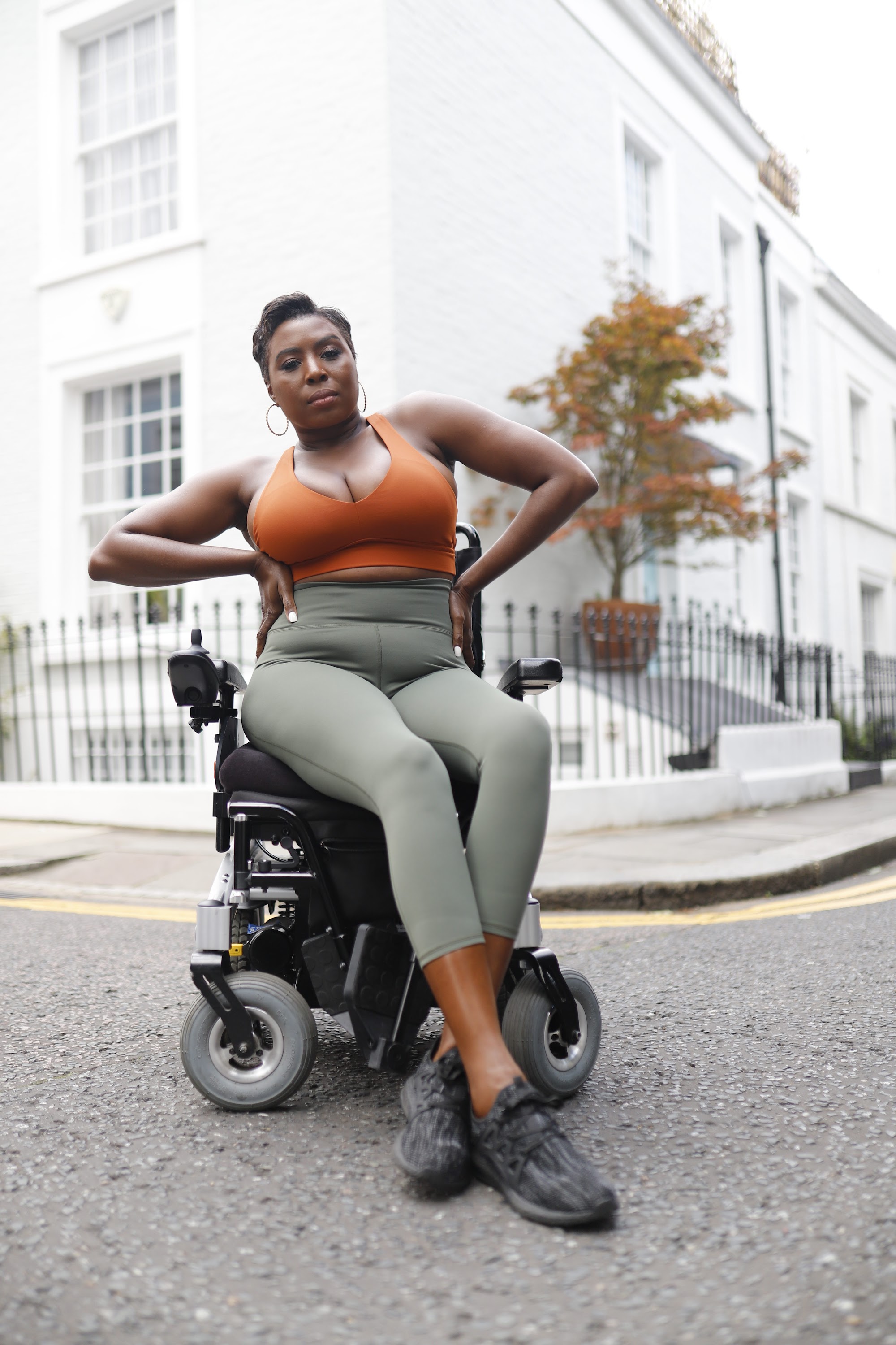 Woman in Power Wheelchair on London Residential Pavement