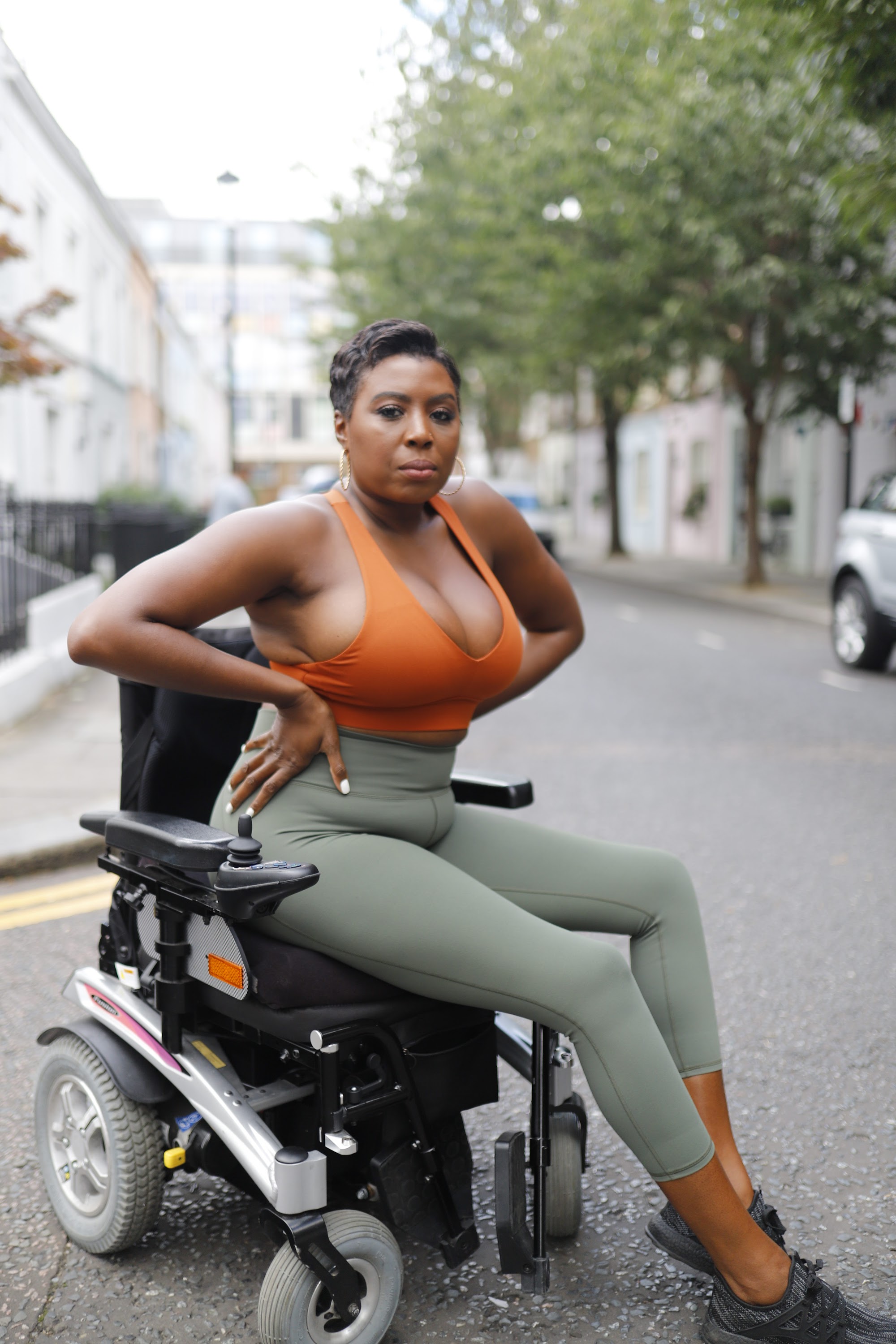 Woman in Power Wheelchair on London Residential Pavement