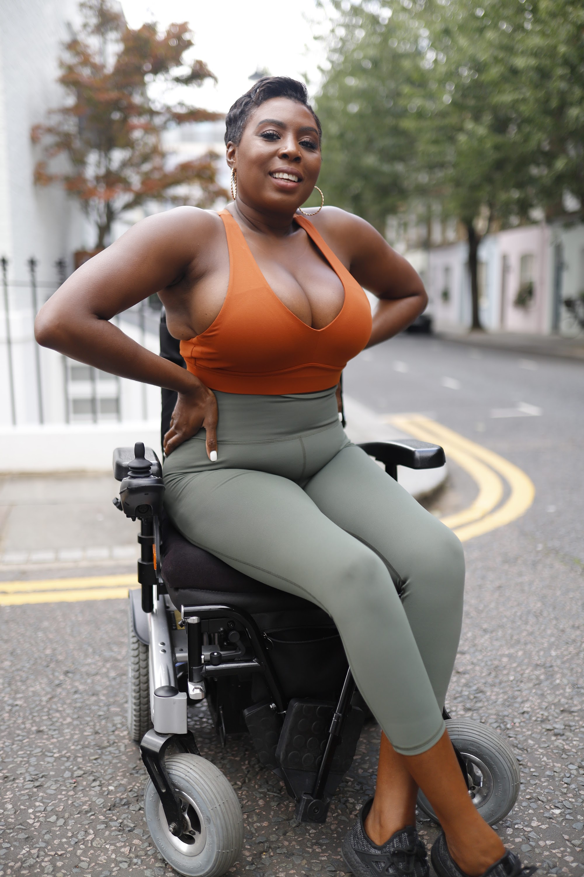 Woman in Power Wheelchair on London Residential Pavement