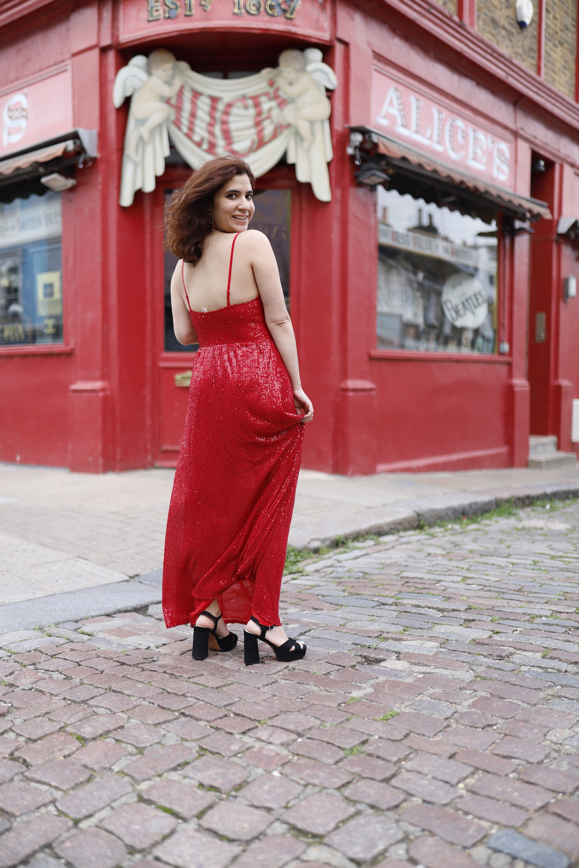 Woman in Red Sequin Dress at Notting Hill, London