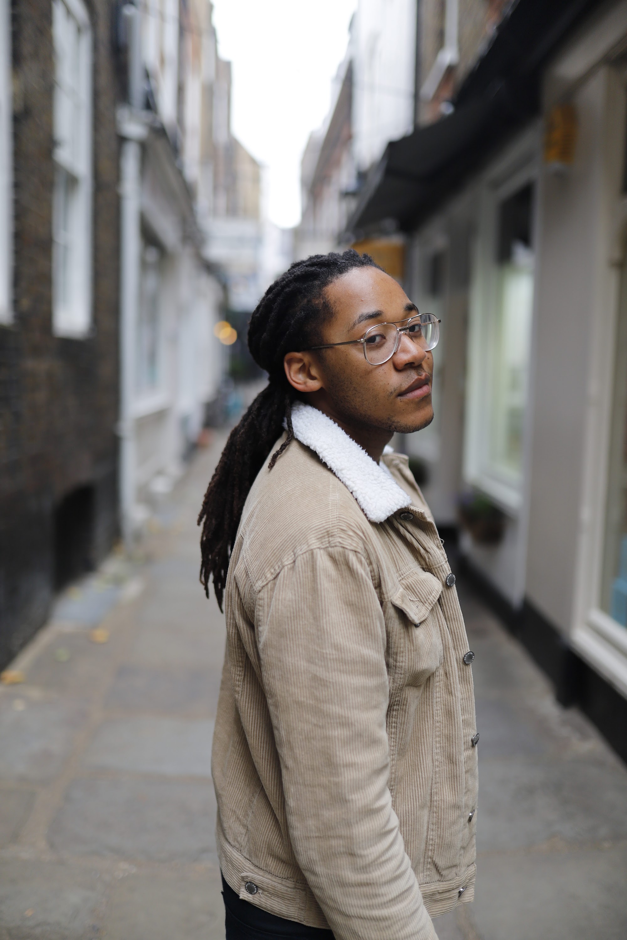 Young Man Portrait in Narrow Urban Alley