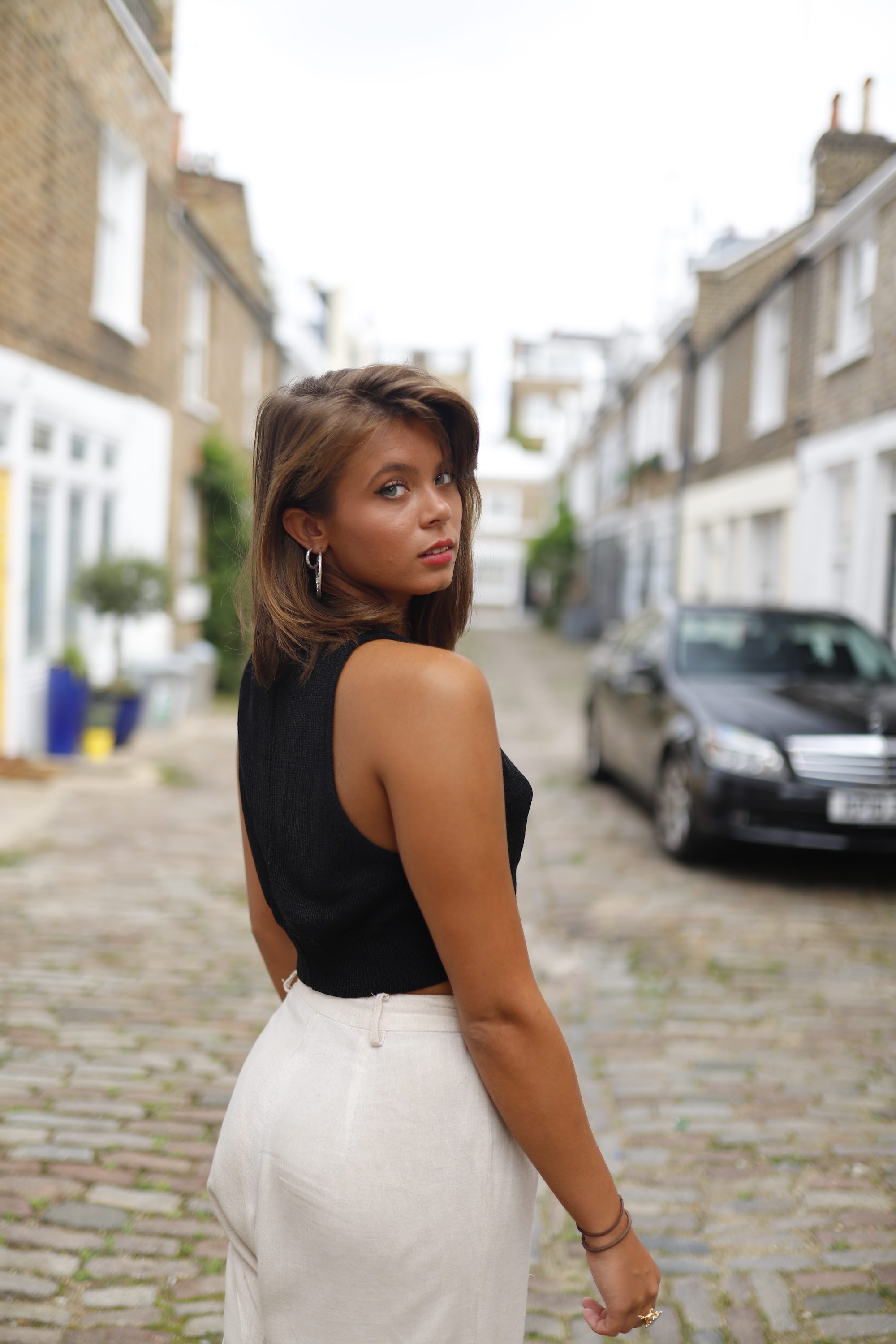 Young Woman Street Portrait on Tree-Lined Sidewalk