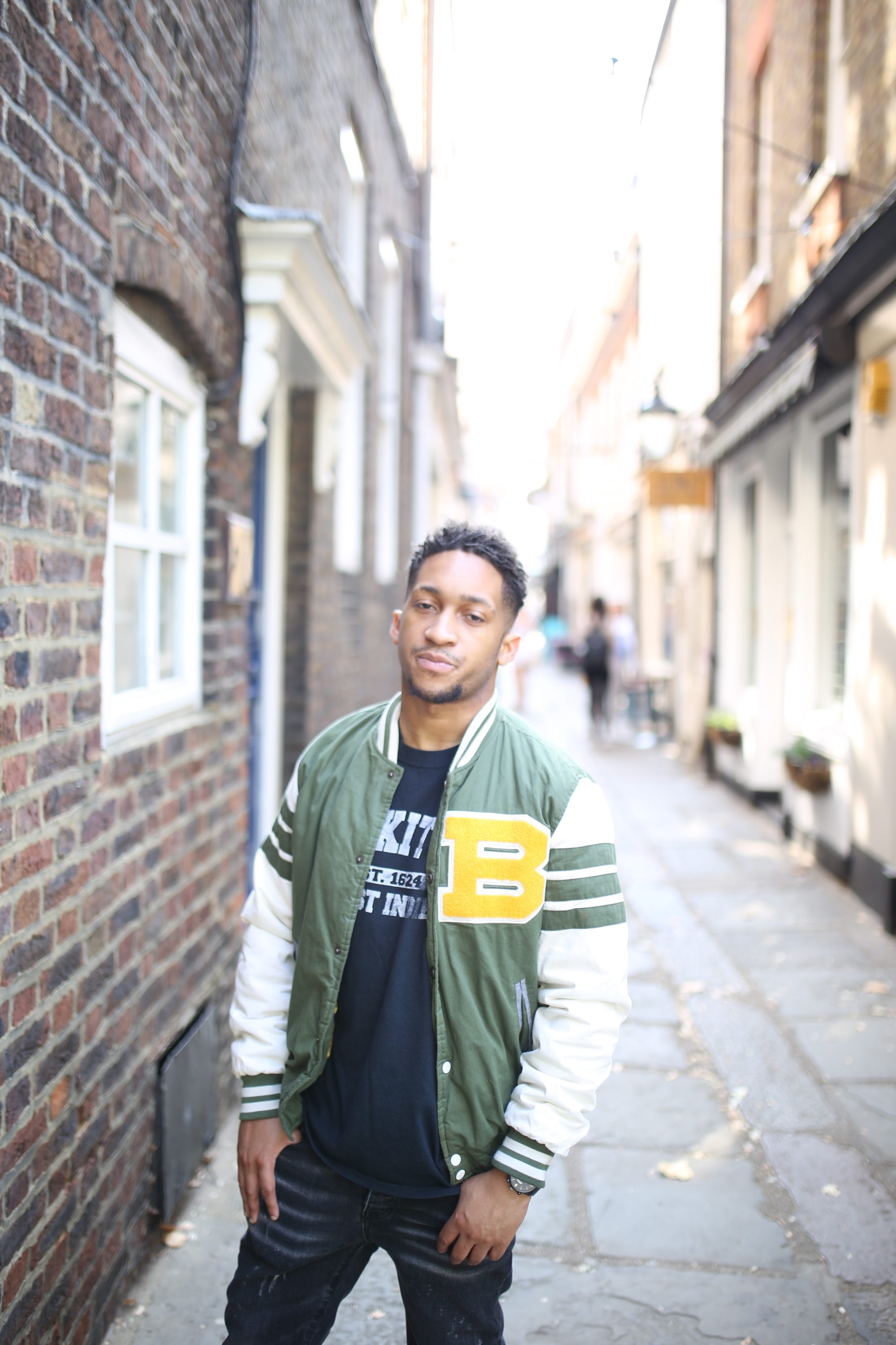 Young Man Outdoor Urban Portrait Against Stone Wall