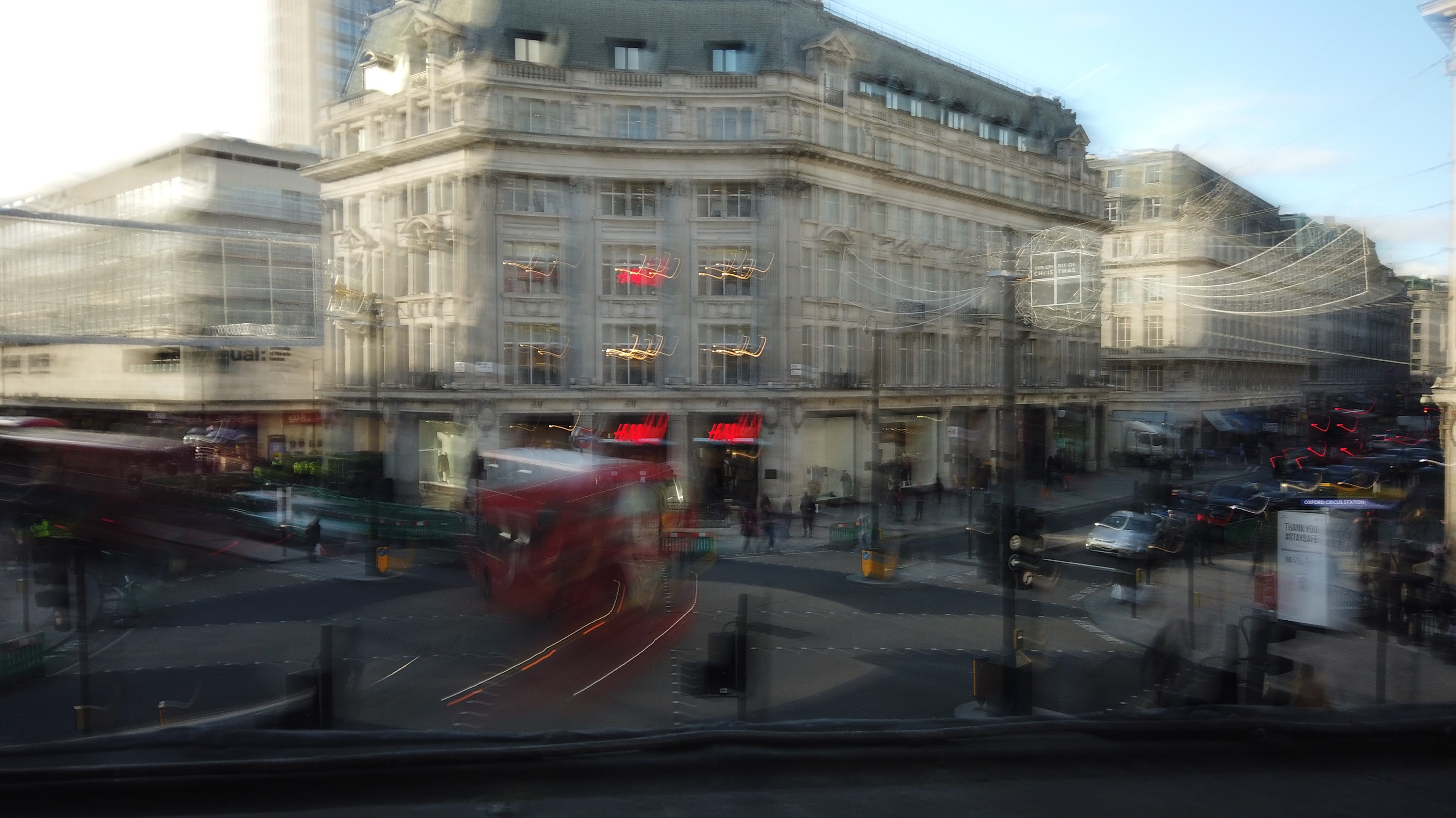 Motion-Blurred London Street with Red Double-Decker Buses