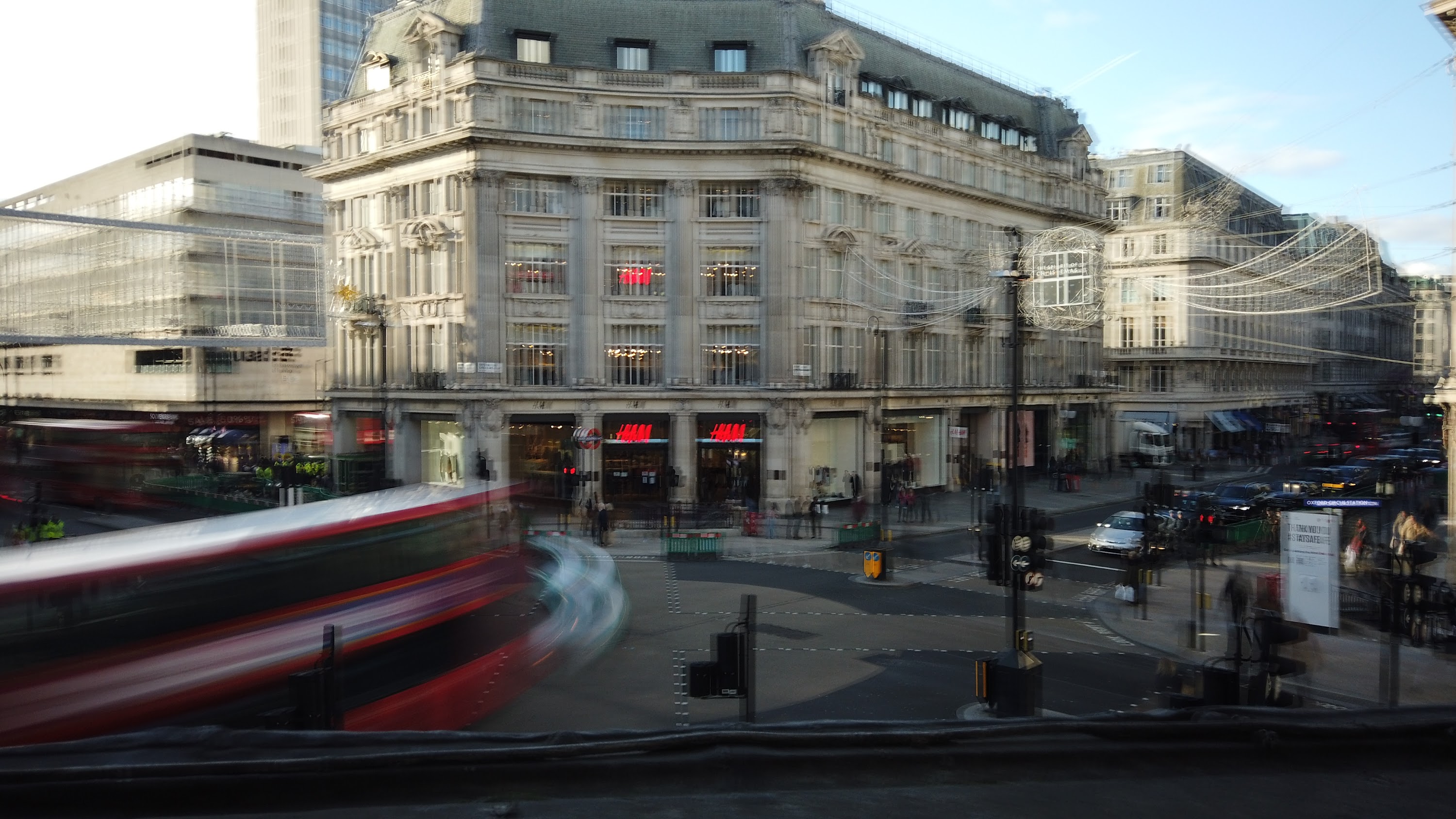 Motion-Blurred London Street with Red Double-Decker Buses