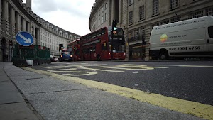 Red Double-Decker Bus Motion Blur on Regent Street, London
