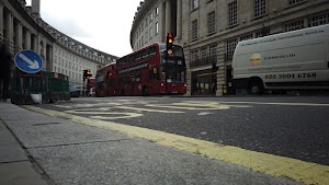 Red Double-Decker Bus Motion Blur on Regent Street, London