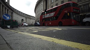 Red Double-Decker Bus Motion Blur on Regent Street, London