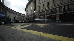 Red Double-Decker Bus Motion Blur on Regent Street, London