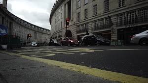 Red Double-Decker Bus Motion Blur on Regent Street, London