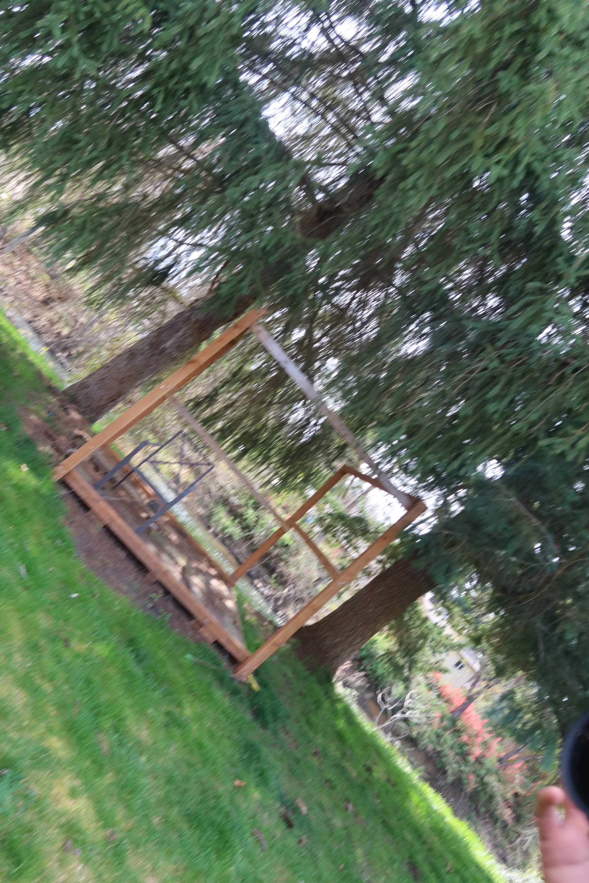 Wooden Frame Structure in a Grass Yard