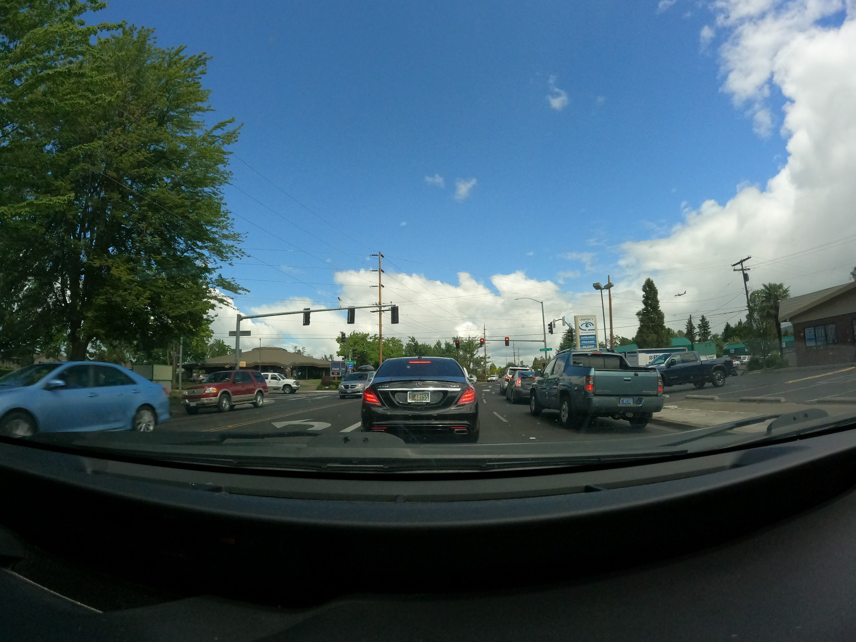 Suburban Intersection with Construction Signage — Dashcam View