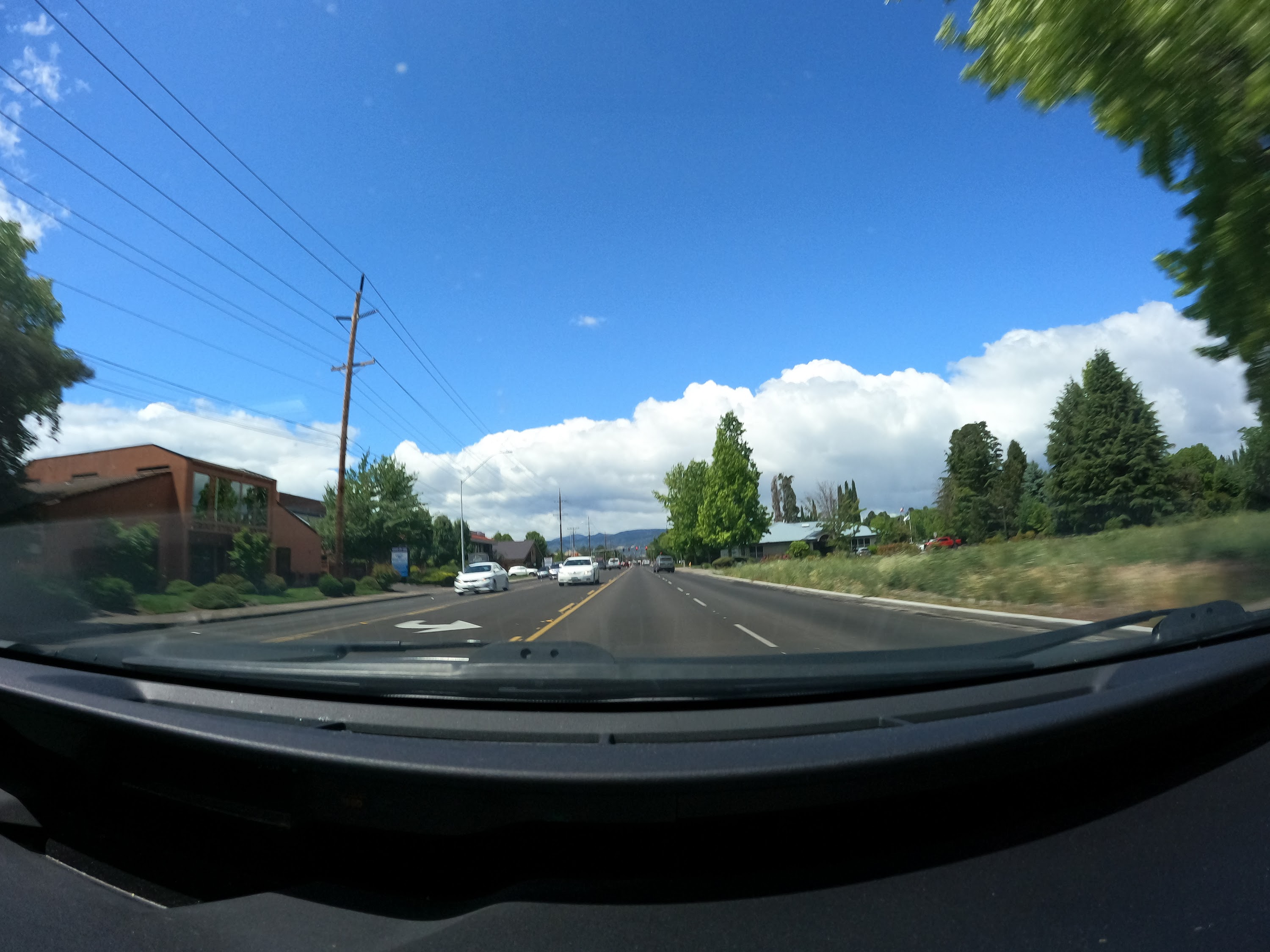 Suburban Intersection with Construction Signage — Dashcam View