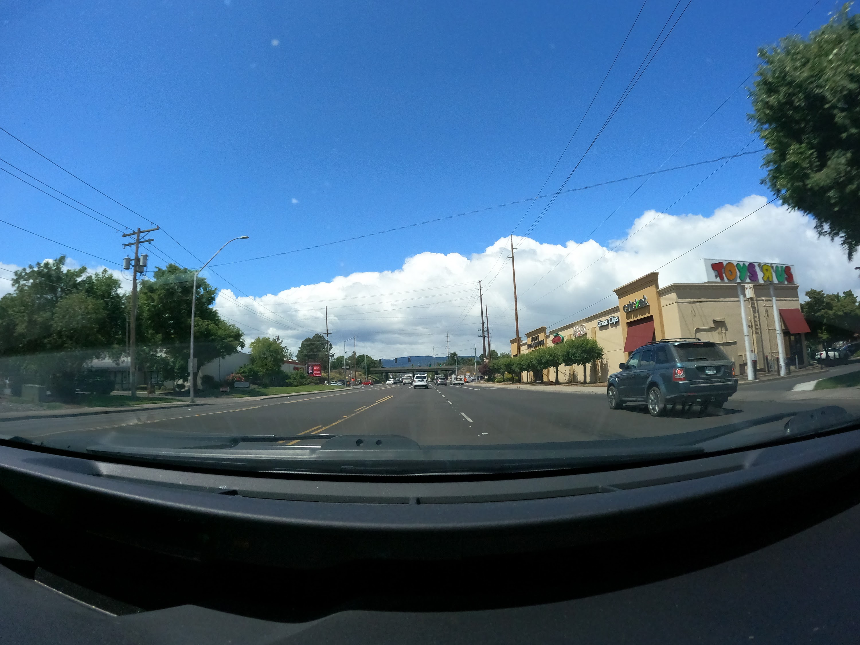 Suburban Intersection with Construction Signage — Dashcam View