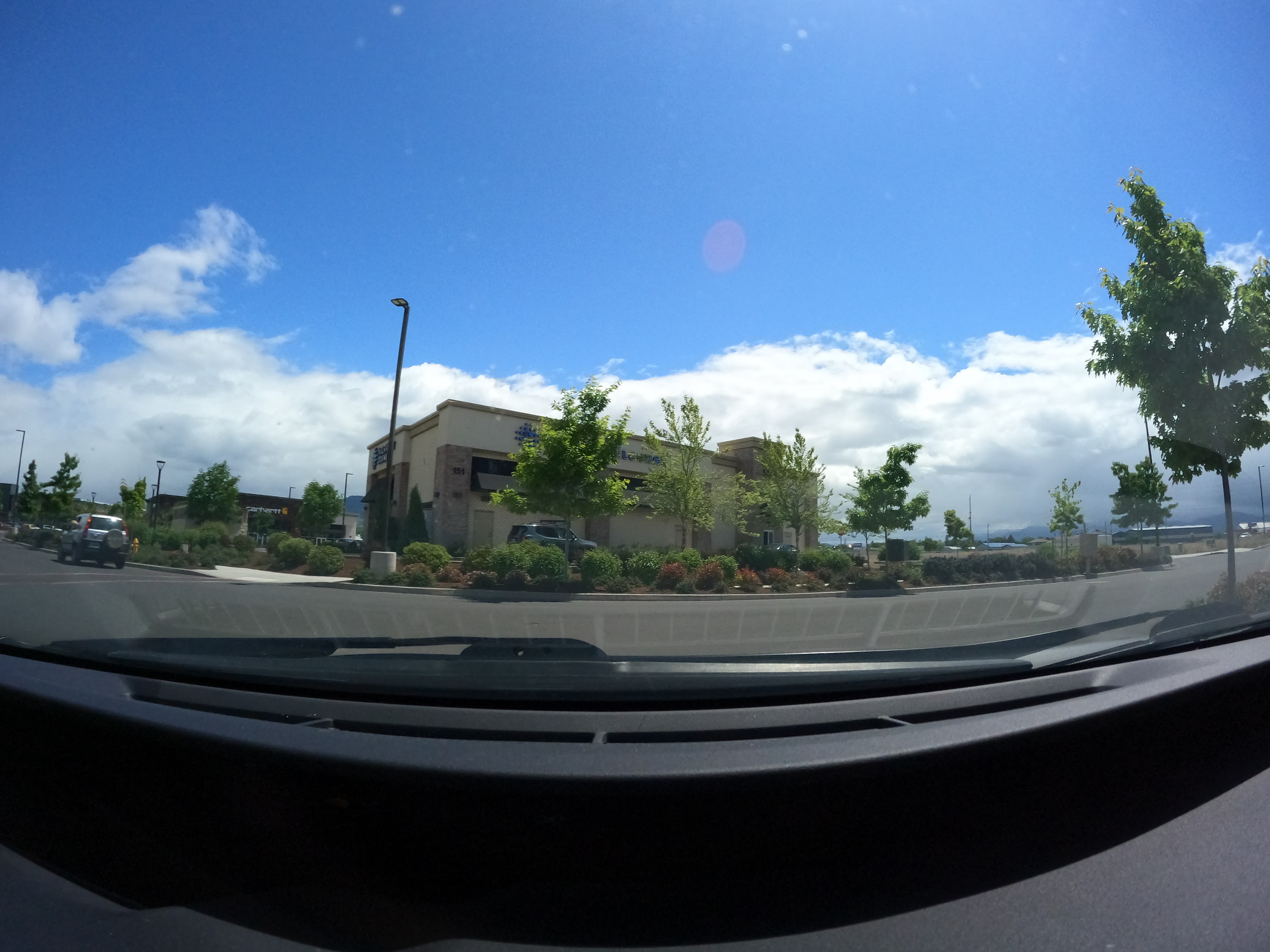 Suburban Intersection with Construction Signage — Dashcam View
