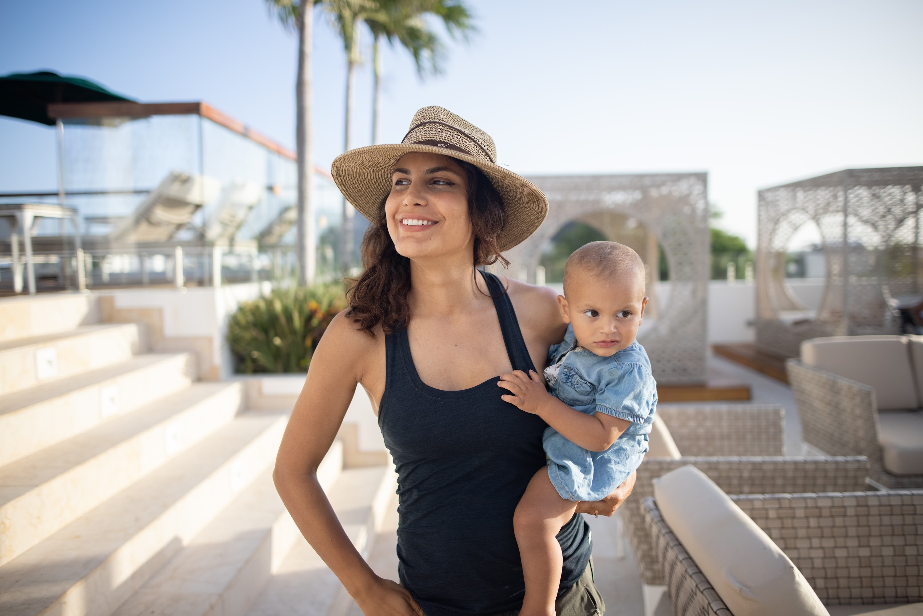 Mother Holding Baby on Rooftop Terrace
